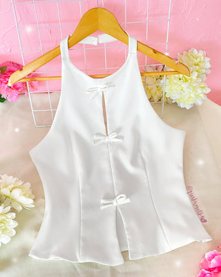 Blusa con 3 moños adelante y tira en el cuello