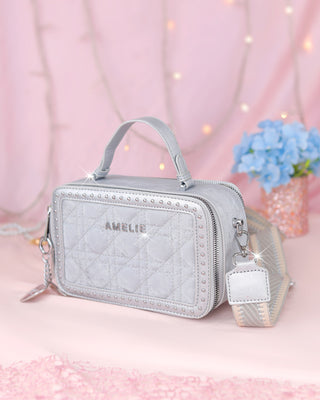 Bolso cuadrado de piel durazno con taches