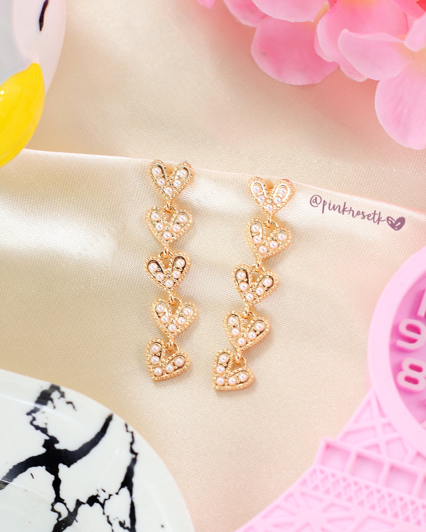 Aretes cinco corazones brillantes