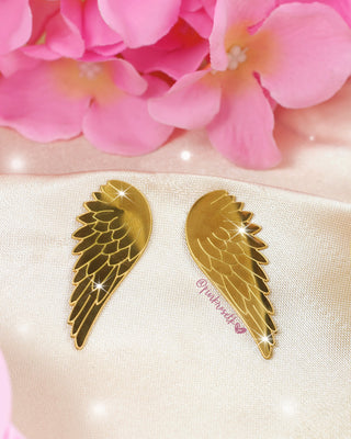 Aretes dorados de maxi alas de ángel