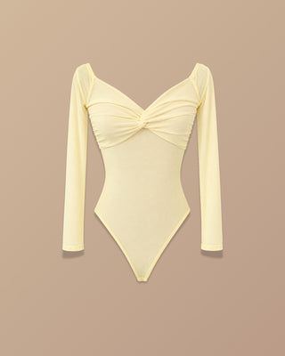 BODY AMARILLO EN MALLATEX MANGA LARGA NUDO EN BUSTO