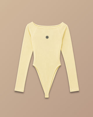 BODY AMARILLO EN RIB MANGA LARGA CON FLOR DE PINK ROSE