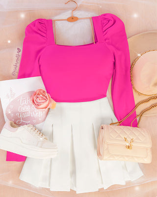 Blusa fucsia en tejido de punto manga puff larga