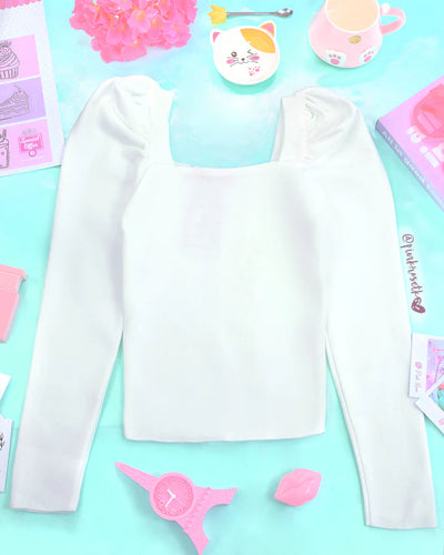 Blusa blanca en tejido de punto manga puff larga