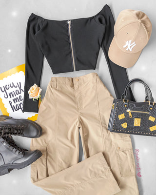 Blusa negra en rib manga larga cremallera adelante