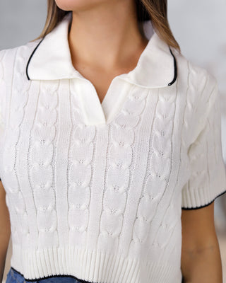 Blusa tejida ancha con cuello y borde color negro