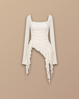 BLUSA BLANCA MANGA LARGA CON  BOLEROS LARGOS A LOS LADOS