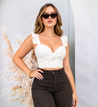 BLUSA BLANCA DE COPAS CON NUDO EN BUSTO Y TIRAS DE BOLEROS