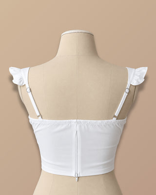 BLUSA BLANCA DE COPAS CON NUDO EN BUSTO Y TIRAS DE BOLEROS