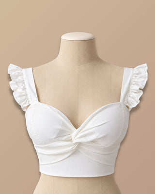BLUSA BLANCA DE COPAS CON NUDO EN BUSTO Y TIRAS DE BOLEROS