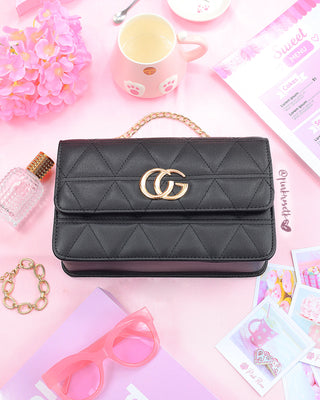 Bolso negro herraje y cadena dorada CG