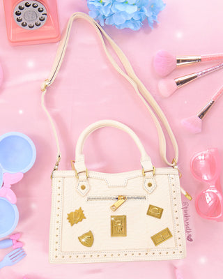 Bolso blanco arena pines astronauta
