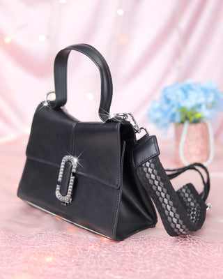 Bolso tipo cartera con broche plateado
