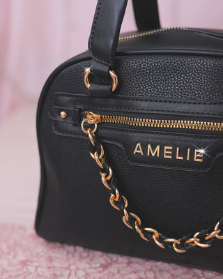 Bolso cuadrado con cadena colgante