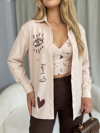 CAMISA MANGA LARGA CON CROP TOP Y ESTAMPADO DE OJOS Y CORAZON