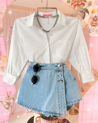 Camisa manga larga con cuello y bolsillo al lado