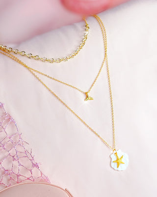 Collar doble con dije estrella y concha de mar