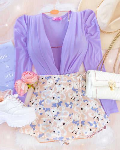 Falda short palo de rosa con tapa y estampado floral