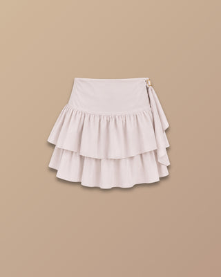 FALDA BEIGE DE BOLEROS CON LAZO AL LADO Y APLIQUE PINK