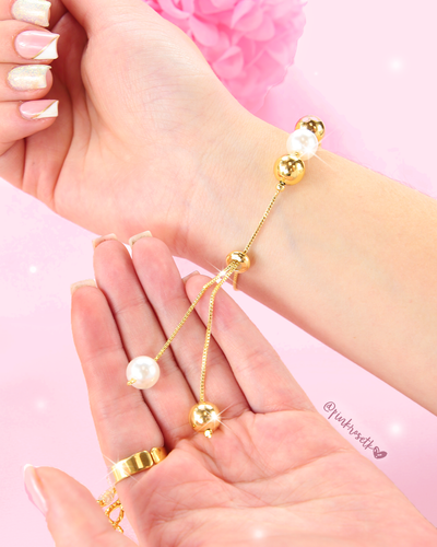 Pulsera balines dorados y blancos