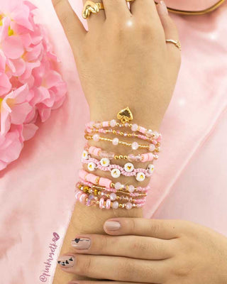 Set nueve pulseras rosadas corazón