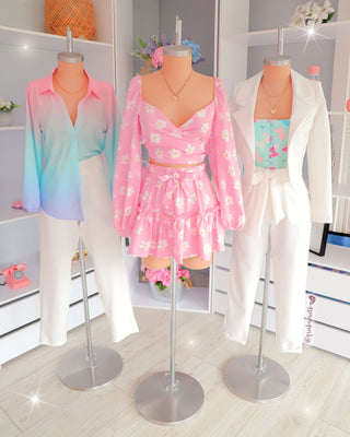 Set rosado de blusa cruzada manga larga y falda margaritas