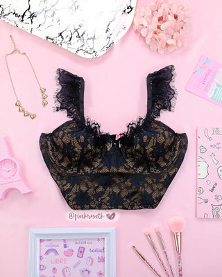 Blusa corta negra de encaje y cierre cremallera