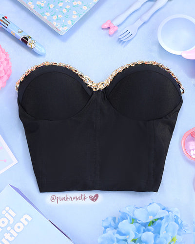 Bustier negro tipo corsé con cadena dorada