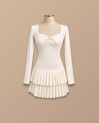 VESTIDO CREMA  MANGA LARGA CON FALDA DE TABLAS Y CORDON