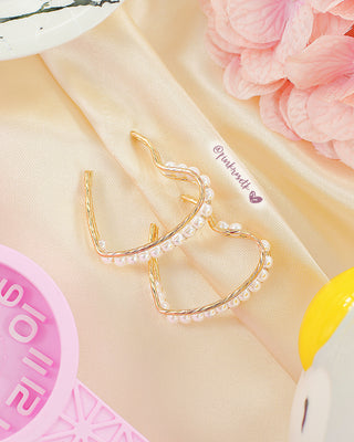 Arete de corazón con perlas blancas