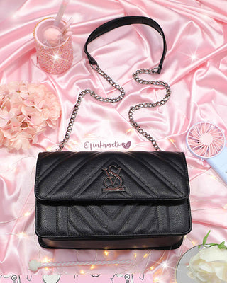 Bolso negro con doble cadena y broche v y s