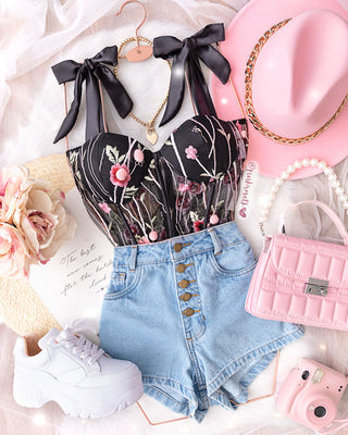 Bustier de lazos y pompones rosa